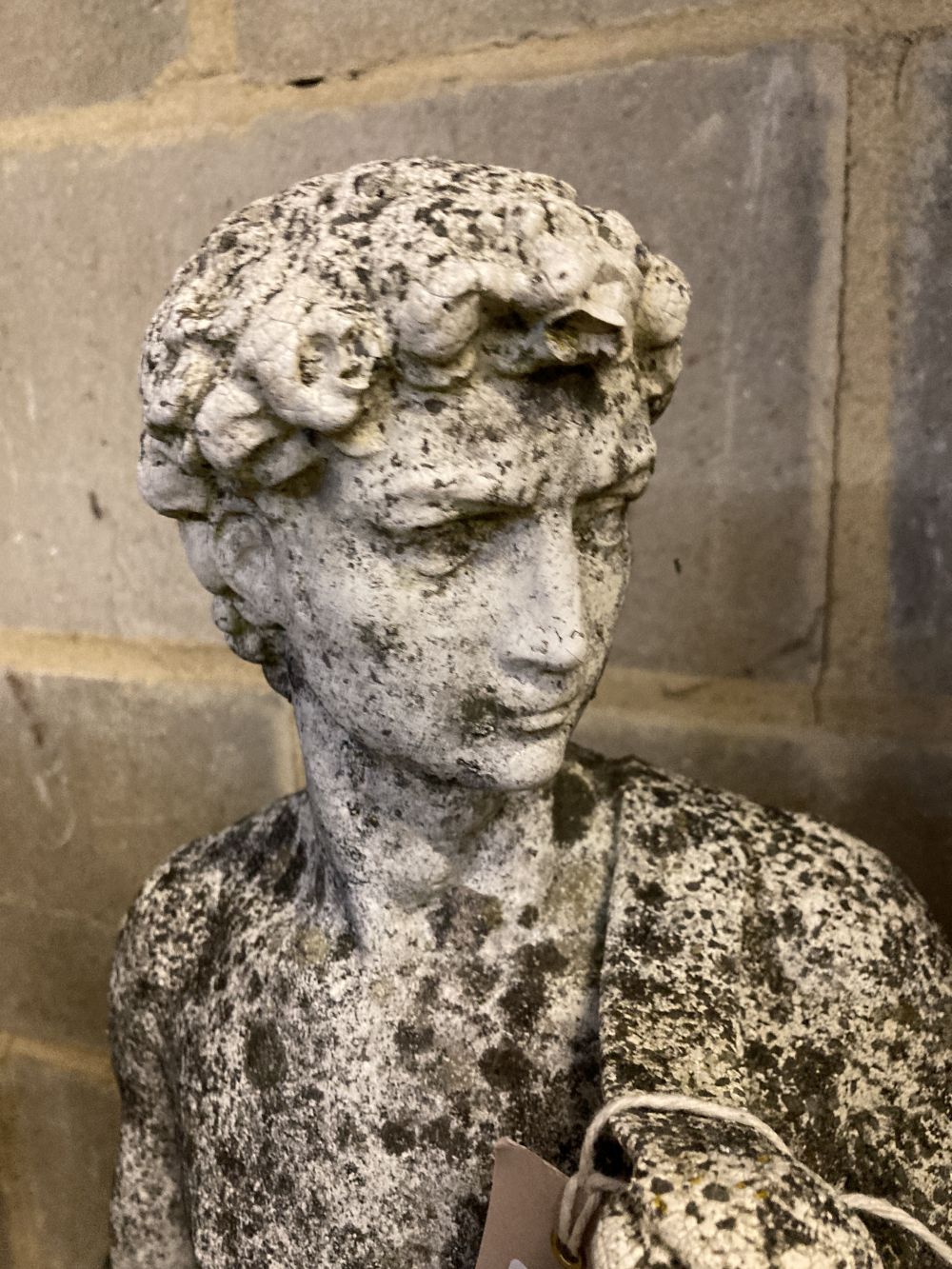 Three reconstituted stone garden ornaments, largest 83cm high